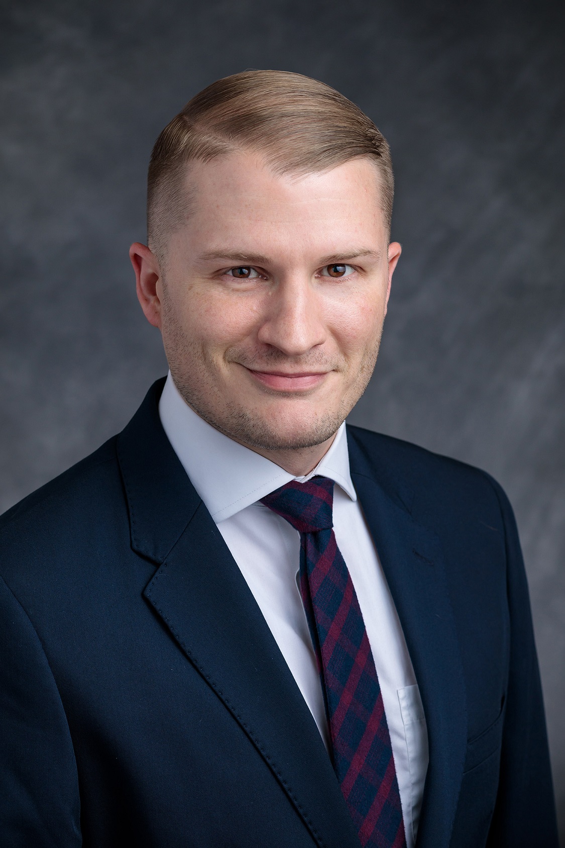Headshot of Tyler Lockman, manager of career advising and student services at The University of Chicago Pritzker School of Medicine and winner of the 2023 Careers in Medicine Excellence in Medical Student Career Advising Support Staff Award